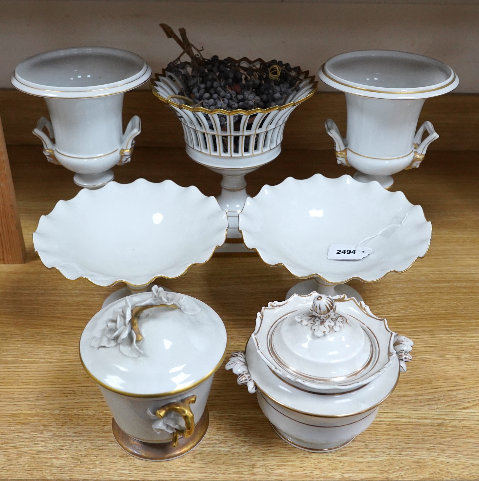 A group of Vista Allegre and other white and gilt porcelain urns, baskets etc, tallest 29.5cm